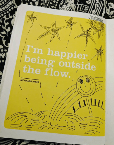 quote reads i am happier outside the flow and is in a journal with drawings of happy faces and black outlined rainbows to demonstrate the idea of being happy with your own freelance idea rather than criticize the ideas of others