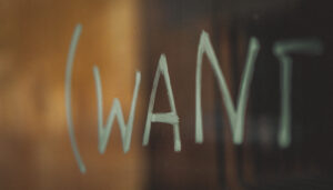Want is scratched onto glass to signify client expectations