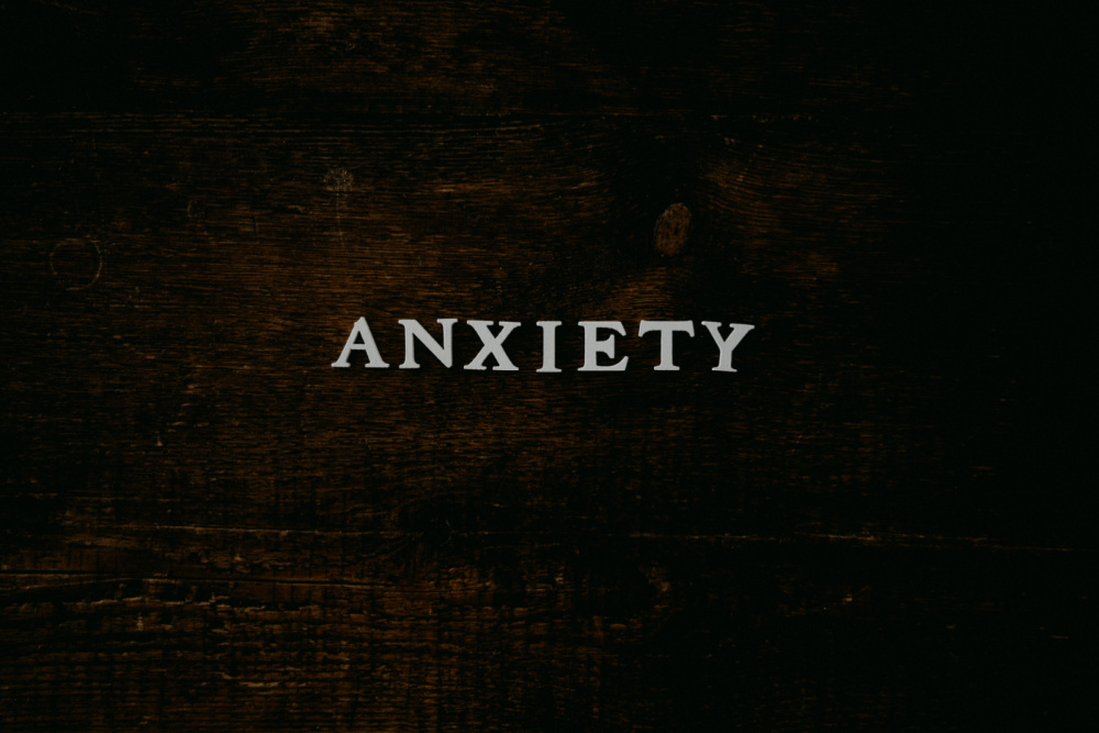 the word anxiety is on a table to signify freelance anxiety