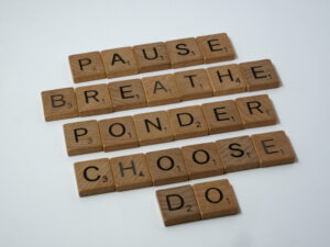 scrabble tilers that read pause, breather, ponder, choose, do in relation to freelance workload overwhelm